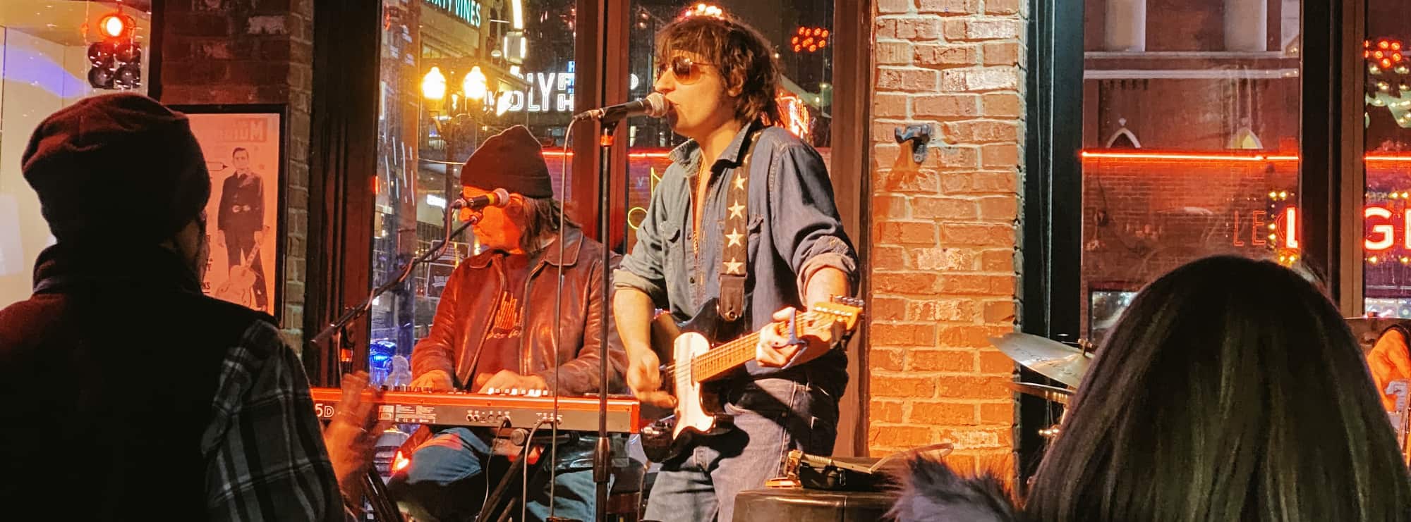 bar singer on guitar in Little Rock