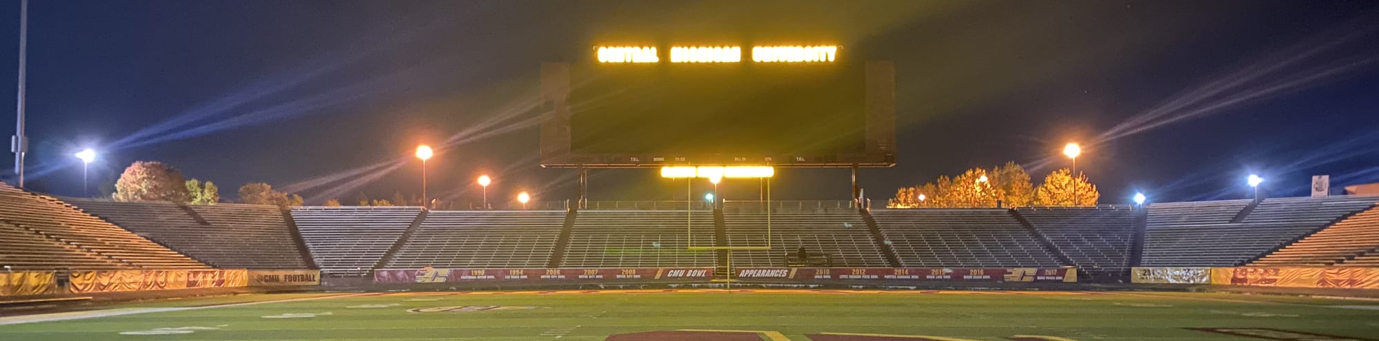 empty football stadium at night under the lights Little Rock