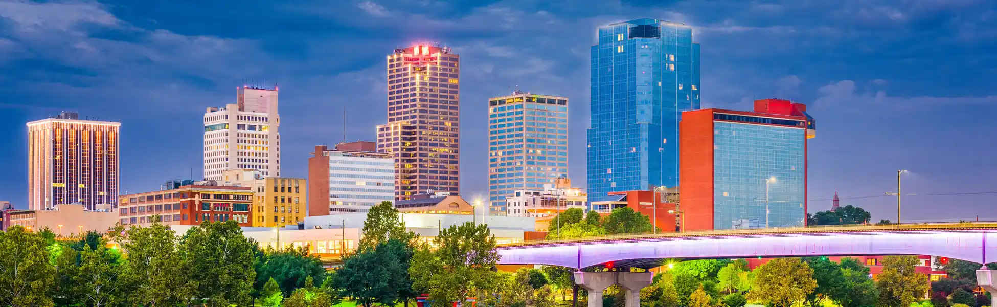 Neon color image of a band playing and people singing along